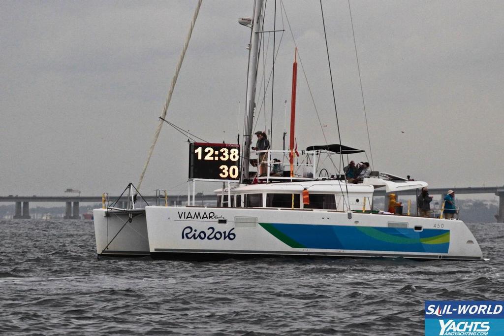 Committee boat lights up in the noon darkness - Day 3, 2016 Olympic Regatta © Richard Gladwell www.photosport.co.nz